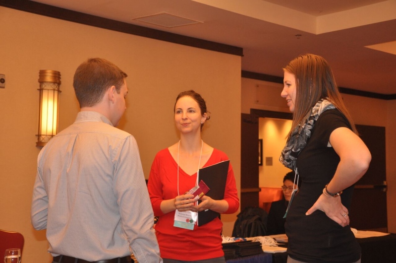 Conference Co-Chairs engage a member in conversation